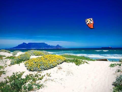 Beach nearby, white sand, beach shuttle, 3 beach bars