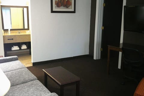 Hypo-allergenic bedding, desk, laptop workspace, blackout drapes