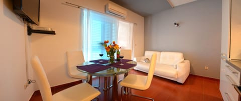 Premium Apartment, 1 Bedroom, Balcony, Sea View | Living area | TV