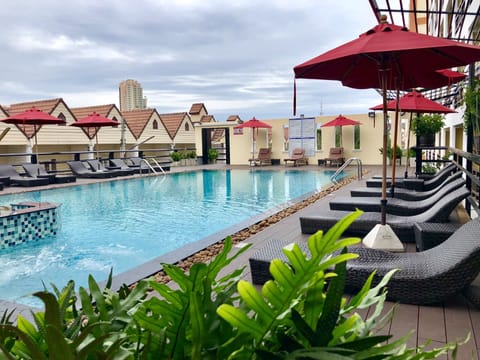 Outdoor pool, open 9 AM to 8 PM, pool umbrellas, sun loungers