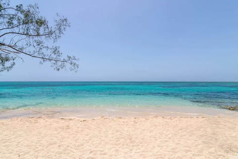 Beach nearby, white sand, beach towels