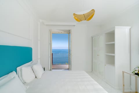 Deluxe Room, Balcony, Sea View | Premium bedding, down comforters, minibar, in-room safe