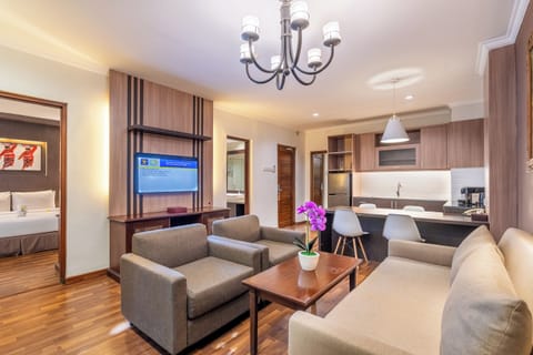 Premier Suite | Living area | Flat-screen TV