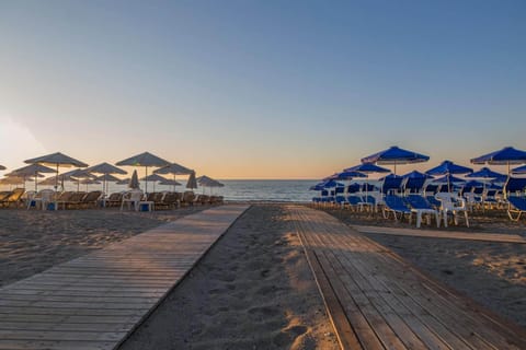On the beach, sun loungers, beach umbrellas, beach towels