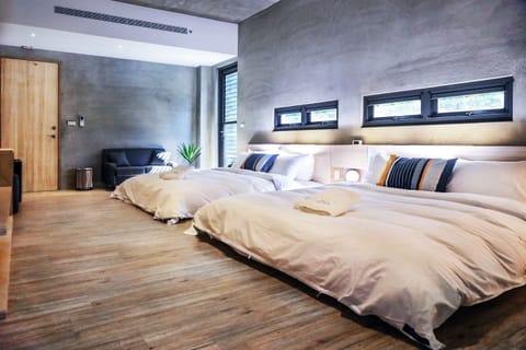 Standard Quadruple Room (Mahumhum) | Free minibar, individually decorated, desk, laptop workspace