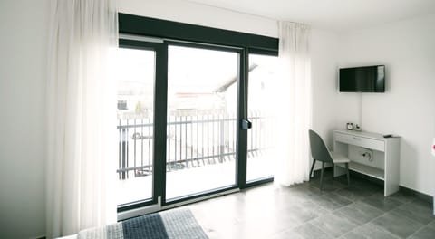 Double Room, Balcony | Living area | Flat-screen TV
