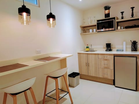 Studio with kitchenette, King bed, 1 bath | Private kitchen | Full-size fridge, microwave, coffee/tea maker, rice cooker