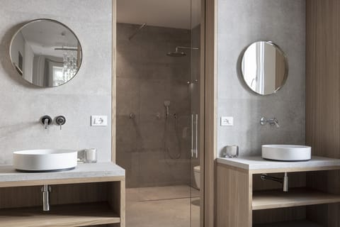 Design Studio Suite | Bathroom | Eco-friendly toiletries, hair dryer, bathrobes, slippers