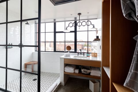 Shower, rainfall showerhead, designer toiletries, hair dryer