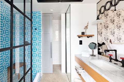 Shower, rainfall showerhead, designer toiletries, hair dryer