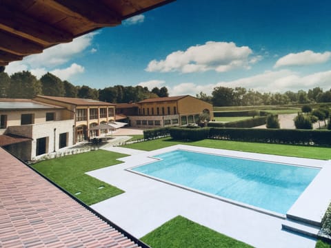 Seasonal outdoor pool, open 10:00 AM to 7:00 PM, pool umbrellas