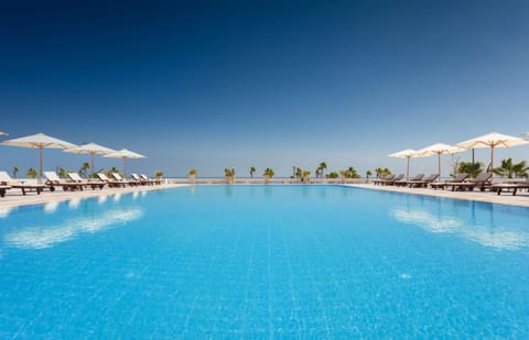 Outdoor pool, pool umbrellas, sun loungers