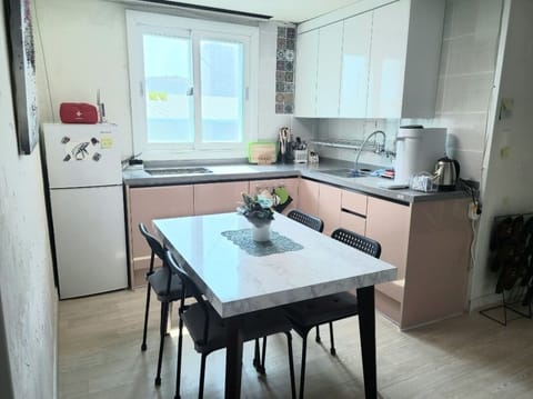 Deluxe Room (303) | Shared kitchen | Fridge, microwave, stovetop, electric kettle