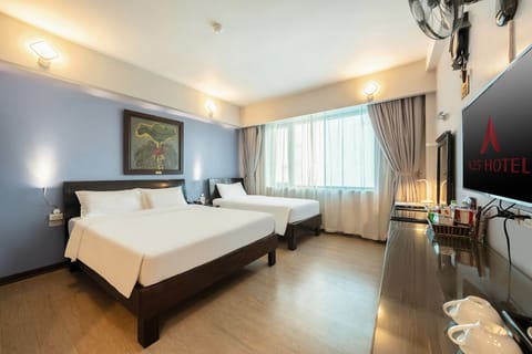 Family Room | Minibar, in-room safe, blackout drapes, iron/ironing board