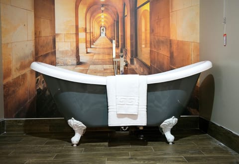 Royal Suite (Basement) | Premium bedding, down comforters, memory foam beds, minibar