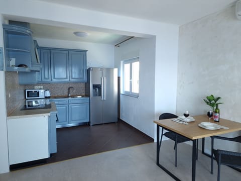 Villa | Private kitchen | Fridge, microwave, oven, stovetop