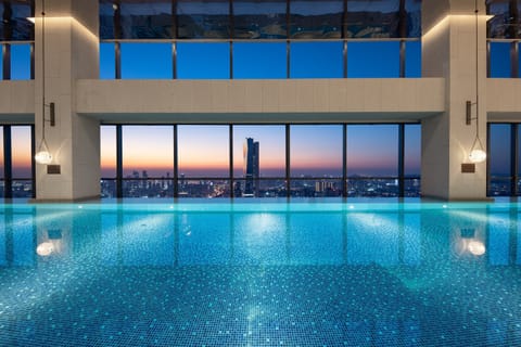 Indoor pool, open 6:00 AM to 11:00 PM, sun loungers, lifeguards on site