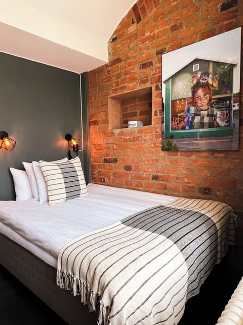 Prison Cell Double Bed | Blackout drapes, free WiFi, bed sheets