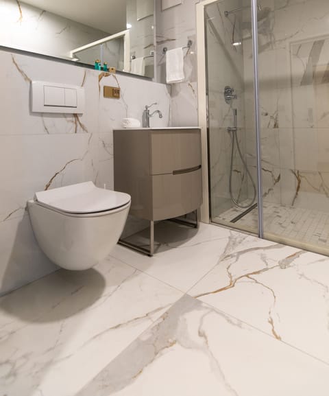 Junior Quadruple Room | Bathroom | Shower, rainfall showerhead, hair dryer, bathrobes