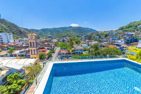 Outdoor pool, open 7:00 AM to 10:00 PM, pool umbrellas, sun loungers