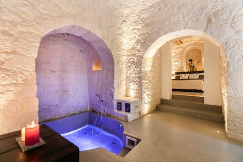 Deluxe Room, Hot Tub (Trullo) | Bathroom | Shower, rainfall showerhead, free toiletries, hair dryer