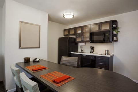 Premium bedding, desk, laptop workspace, iron/ironing board