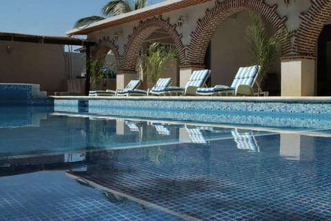 Outdoor pool, open 8:00 AM to 9:00 PM, pool umbrellas, sun loungers