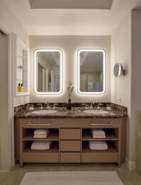 Designer toiletries, hair dryer, bathrobes, slippers