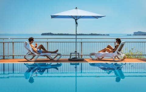 Seasonal outdoor pool, pool umbrellas, sun loungers