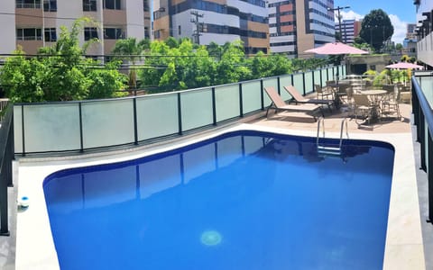 Outdoor pool, pool umbrellas, sun loungers