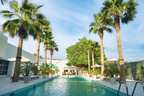 Outdoor pool, open 7:00 AM to 7:00 PM, sun loungers