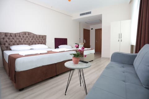 Family Triple Room | Minibar, desk, soundproofing, iron/ironing board