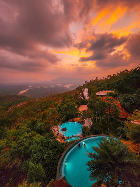 Outdoor pool, an infinity pool, open 8:00 AM to 8:00 PM, pool umbrellas