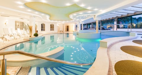 Indoor pool, seasonal outdoor pool, open 7 AM to 7:30 PM, pool umbrellas