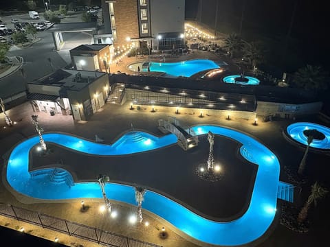 Outdoor pool, open 6:00 AM to 11:00 PM, free cabanas, pool umbrellas
