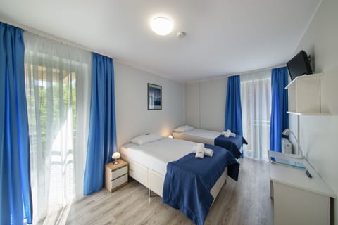 Down comforters, pillowtop beds, in-room safe, desk