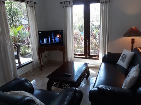 Family Room, 2 Bedrooms, Connecting Rooms, Pool View | Living area | 32-inch LED TV with cable channels, TV