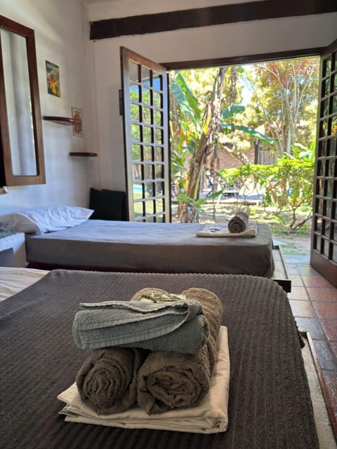 Triple Room, Multiple Beds, Pool View | Free WiFi, bed sheets