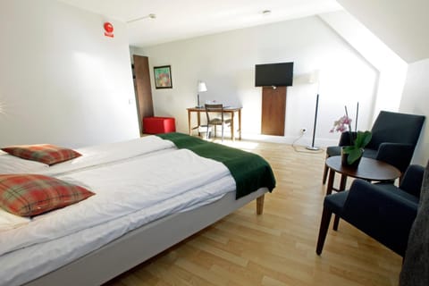 Desk, iron/ironing board, free cribs/infant beds, rollaway beds