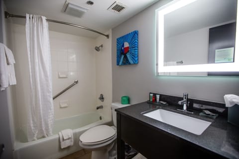 Premium bedding, desk, laptop workspace, blackout drapes