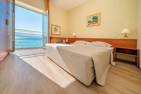 Apartment, Sea View, Poolside | Premium bedding, down comforters, minibar, in-room safe