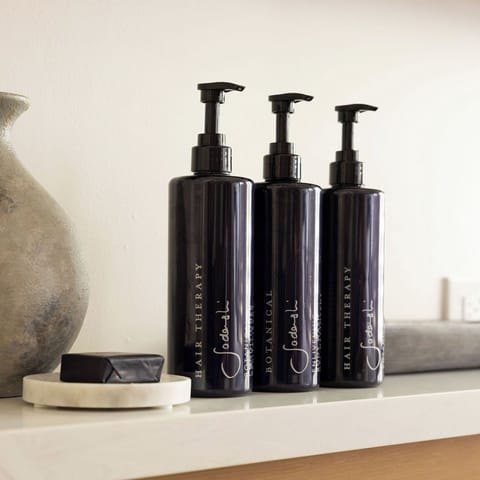 Shower, designer toiletries, hair dryer, towels