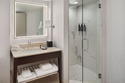 Designer toiletries, hair dryer, towels