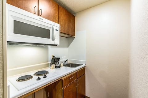 Fridge, microwave, stovetop, cookware/dishes/utensils