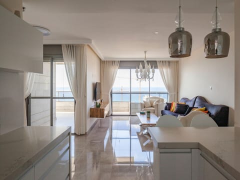 Luxury Apartment | Living area | 50-inch plasma TV with cable channels, TV