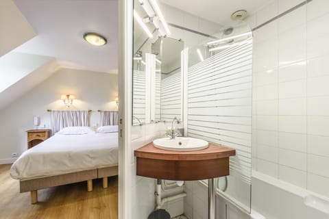 Bathtub, eco-friendly toiletries, hair dryer, towels