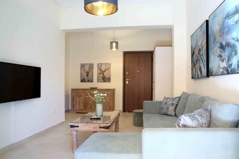Deluxe Apartment, 2 Bedrooms, Balcony, City View | Living room | Flat-screen TV