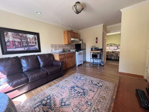 King Suite with Courtyard View | Living area | Flat-screen TV, toys