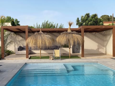 Outdoor pool, pool umbrellas, sun loungers