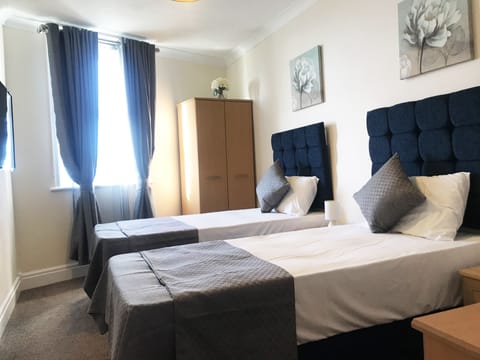 Individually furnished, desk, laptop workspace, blackout drapes